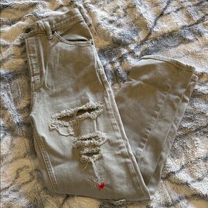 Green/grey ripped jeans